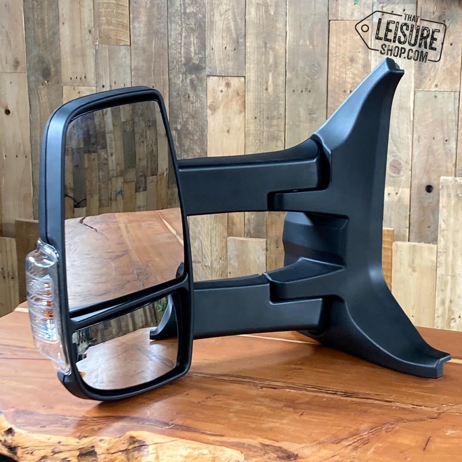 Wing mirror unit. Genuine Ford Transit 2014-2019 black, manual, long arm, clear indicator, nearside