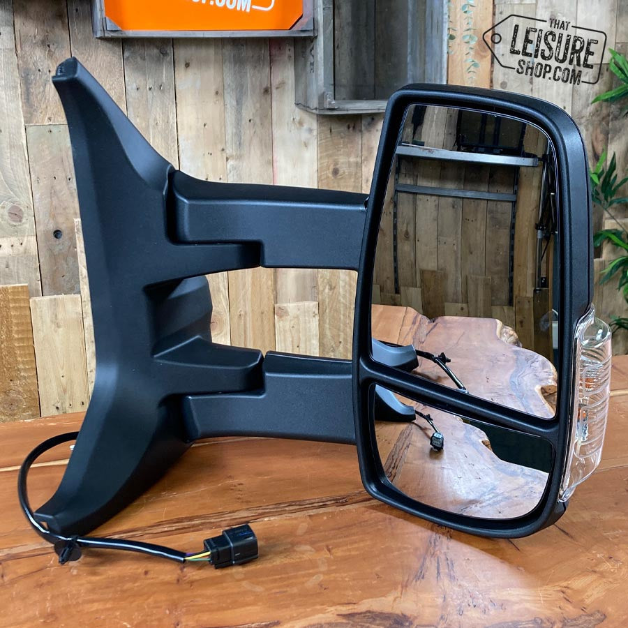 Wing mirror unit. Genuine Ford Transit 2014-2019 black, manual, long arm, clear indicator, offside